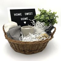 a wicker basket filled with home sweet home items