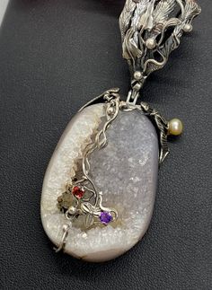 "UNIQUE DRUZY PENDANT Hand-made Sterling Silver , 24 k Gold. Stones used: Druzy, Pearls, Garnet, Amethyst. Height - 78mm, Width - 30mm Unique Handcrafted One-of a-kind Design Pendant Each Piece of Jewelry in my Collection is Absolutely One of a Kind! When you start wearing a piece of my jewelry you will fall in love with it more and more each day and feel that good Energy and Love that I pass into it while creating this piece of Art. A piece of Art created for you to be inspired and love it thro Handmade Luxury Custom Necklace, Artisan Pendant Necklace With Unique Design, Artistic Pendant Necklace With Unique Design, Luxury Handmade Oval Pendant Necklaces, Handmade Oval Pendant Necklaces For Formal Occasions, Handmade Rectangular Pendant Necklace For Formal Occasions, Handmade Formal Necklace With Rectangular Pendant, Artisan Necklace With Unique Variations, Handmade Formal Necklaces With Oval Pendant