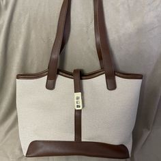 Brown, Faux, Leather Trimmed Handbag Tan Canvas. Zip & Clasp Closure. 1 Interior Zip Pocket. Brand New Without Tag, In Bag. Tan Handbags, Leather Trims, Shoulder Bags, Zip Pockets, Faux Leather, Bag Lady, Purse, Shoulder Bag, Brand New