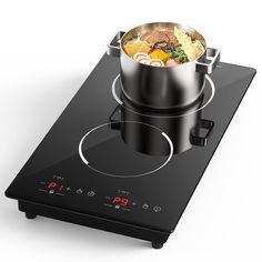 a pot on top of a stove with food cooking in it's burners