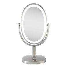 a round mirror sitting on top of a metal stand