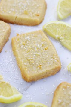 lemon shortbreads with sea salt and lemon wedges on the side, ready to be eaten