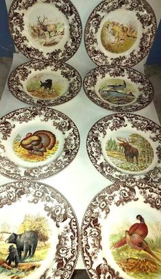 six plates with animals painted on them