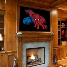 a living room filled with furniture and a fire place in front of a tv mounted on the wall