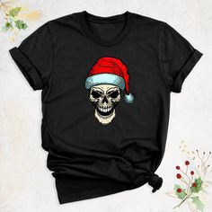 Christmas Skull Shirt, Santa Skeleton Shirt, Funny Christmas Shirt, Christmas Party Shirt, Creepy Christmas Shirt, Sugar Skull Santa Hat Tee Hello, Thanks for your support. Your gladness comes first and all work is done with LOVE in here. Always keep your support, please:)  Christmas Skull Shirts are branded Bella+Canvas.   Christmas Skull Shirt Contents: - Solid colors: %100 Cotton. - Heather colors: %52 Cotton + %48 Polyester* This ultra-soft graphic tee is made from a comfortable cotton-poly Skull Christmas Shirt, Christmas Party Shirts, Creepy Christmas, Skeleton Shirt, Skull Shirts, Funny Christmas Shirts, Christmas Humor, Christmas Shirts, Graphic Shirts