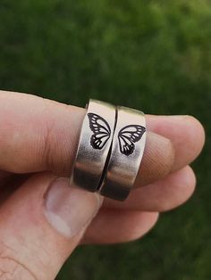 Butterflies represent change, and the courage to embrace a transformation that makes life better. Get this matching butterfly wing ring set for your best friend, sister, or partner. Featuring a gorgeous detailed butterfly wing on each ring. DETAILS: -Two Matching Rings -Each ring is hand stamped -Ring is Aluminum, Sterling Silver, Fine Silver, Rose Gold Filled, or 14k Gold Filled -6mm in thickness**Please note, this ring is OPEN BACK and adjustable** You will receive two hand-stamped rings fille Matching Rings For Siblings, Best Friend Rings Aesthetic, Matching Promise Rings Aesthetic, Matching Friendship Rings, Matching Best Friend Gifts, Personalized Adjustable Butterfly Jewelry, Adjustable Sterling Silver Jewelry With Butterfly Charm, Butterfly Charm Ring For Anniversary, Adjustable Rose Gold Jewelry With Butterfly Charm