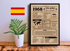 a poster on a table with a potted plant next to it and a flag in the background