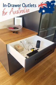 an open drawer in the middle of a wooden floor with text overlay that reads in - drawer outlets for australia