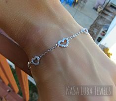 "Cubic Zirconia Heart Dainty SOLID sterling stamped 925 silver Tarnish free Bracelet 7 inch up to 8inch This is a 7\" and goes up to 8\" (Adjustable) - Prong setting, with 80 clear RoundCubic Zirconia bracelet. The thickness of this bracelet is 2mm and the height 7.2 This is SOLID Sterling silver with Rhodium plating which makes this Tarnish free! Please follow care instructions. Any rings with stones, regardless where you purchase, must be removed when washing hands or using hair gels or hair c Silver Cubic Zirconia Heart Bracelet For Valentine's Day, Silver Dainty Bracelet For Valentine's Day, Dainty Silver Bracelets For Valentine's Day, Elegant Sterling Silver Heart Bracelet Gift, Dainty Silver Bracelet For Valentine's Day, Dainty Sterling Silver Bracelets For Valentine's Day, Sterling Silver White Gold Heart Bracelet For Wedding, Dainty Sterling Silver Heart Bracelet, Dainty Heart-shaped Sterling Silver Bracelet