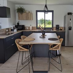 the kitchen is clean and ready to be used for cooking or relaxing time in someone's home