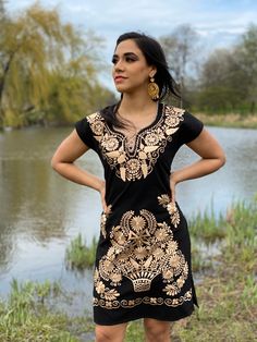 This Beautiful Mexican Gold Floral Dress is the perfect dress for a fun night out or a special event. It's made out of cotton and is full of gold embroidered details. This dress has ties on the back for an adjustable fit. The earrings you can buy too and you can find here https://www.etsy.com/es/listing/637147293/filigrana-redonda-filigrana-clasica?ref=shop_home_active_1&pro=1&frs=1 Traditional Fitted V-neck Dress, Fitted V-neck Dress With Embroidered Neckline, Traditional Gold Dress With Gold Embroidery, Elegant Gold Dress With Resham Embroidery, Festive Wedding Dress With Embroidered Hem, Elegant Fitted Dress With Gold Embroidery, Traditional Fitted Dress With Gold Embroidery, Festive Fitted Floral Embroidered Dress, Gold Embroidered V-neck Dress