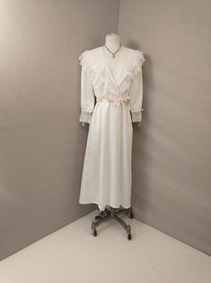 "Beautiful Christian Dior light robe long - mid length, romantic style. Wide lace trim, blush pink ribbon detailing. Inset side pockets Condition is good, with some imperfections. Subtle and scattered pricks to fabric, has been hemmed, replaced belt, some restitching at lace near belt loop. Vintage 90's possibly earlier. Made in USA retains union tag. Quality construction. Washable. Size marked Petite, please go by measurements to determine best fit. Length 51\" Shoulders 15\" Bust to 40\" Waist Feminine Cream Nightgown With Lace Trim, Spring Feminine Lace Patchwork Nightgown, Feminine Lace Patchwork Nightgown, Feminine Delicate Lace Nightgown, Feminine Spring Wedding Nightgown, W Blush, 90s Lingerie, Goth Prom, Green Plaid Shirt