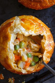 a chicken pot pie with a spoon in it