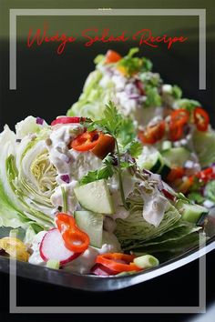 a salad with lettuce, carrots and other veggies on a plate