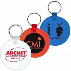 three different colored round key tags with the logo on each one and an orange, blue, and black circle