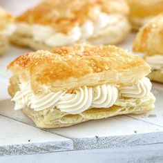 several pastries sitting on top of a white counter