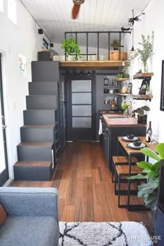 the interior of a tiny house with stairs