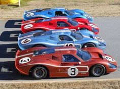 a row of race cars lined up on the track