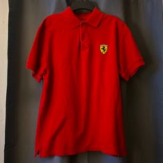 Red Ferrari Polo Tee Never Worn Like Brand New Soft Material No Stains Size Medium Classic Red Fitted T-shirt, Red Fitted Short Sleeve Polo Shirt, Fitted Red Polo Shirt With Polo Collar, Red Fitted Polo Shirt, Fitted Red Polo Shirt, Red Fitted Polo Collar T-shirt, Red Casual Polo Shirt, Casual Red Polo Shirt, Red Fitted Cotton Polo Shirt