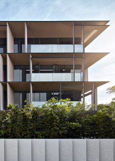 an apartment building with balconies on the side