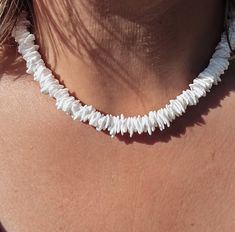 The ideal summer necklace for a sun soaked beach vibe. This simple choker necklace with real, natural puka shell chip beads is perfect for a casual beach babe aesthetic. Finished with a toggle clasp which can be worn front or back. ▪️Natural puka shell chips ▪️Toggle clasp ▪️Length - 18 inches ▪️Comes in attractive Scraffs packaging ready to gift or keep Poca Shell Necklace, Puka Shell Chip Necklace, Puka Shell Necklace Aesthetic, Beach Necklace Aesthetic, Beach Babe Aesthetic, Summer Necklace Ideas, Puka Necklace, Simple Choker Necklace, Chip Necklace