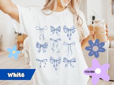 Embrace the coquette aesthetic with this adorable design featuring girly light blue bows, perfect for those who love all things sweet and stylish.  Comfort Colors Tee available in up to a size 4XL in 6 feminine colors. 🙃ITEM SIZING🙂 - Please READ. Please refer to the images for size charts.  Please remember that this is Unisex (men's) sizing.  We recommend sizing up 2 for the oversized look.  If there is no picture of a design on the front of the garment, the front is blank.  The design does s Cute Blue T-shirt For Gift, Blue Kawaii Style Crew Neck T-shirt, Blue Kawaii Crew Neck T-shirt, In My Soft Girl Era, Trendy Crew Neck T-shirt With Bow, Cute Pink T-shirt With Bow Detail, Feminine Colors, Cute Cotton T-shirt With Pink Bow, Bows Coquette