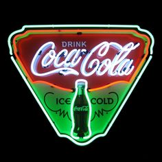 a neon sign that says drink coca - cola on it's front and side