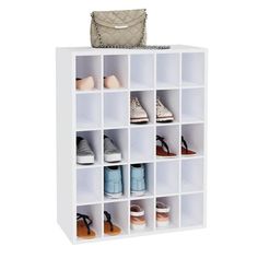 a white cubby with shoes and purse on top