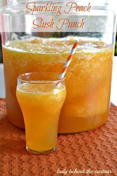 two glasses filled with orange juice on top of a table