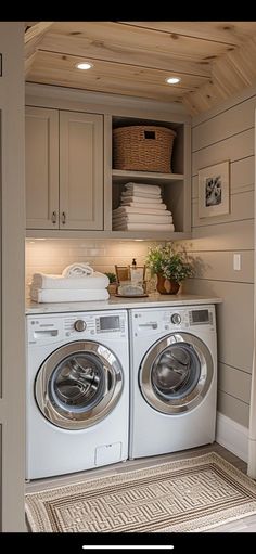 a washer and dryer in a small room