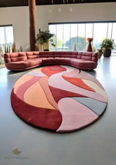 a large circular rug in the middle of a room