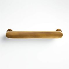 an old brass door handle on a white wall