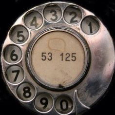 an old style phone with numbers on it