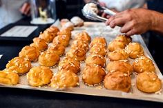 there are many pastries on the tray ready to be eaten