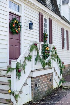 christmas decorations on the front steps of a house