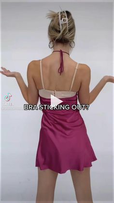 the back of a woman's dress with her hands out in front of her