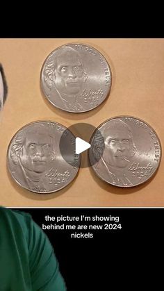 the man is looking at three silver coins on top of each other, and then he has to make an odd face