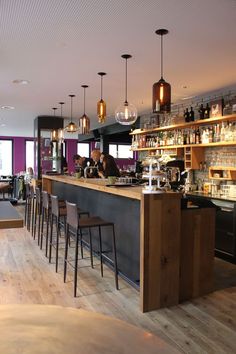 a bar with several stools in front of it