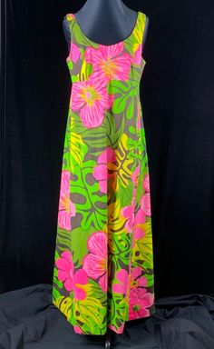 "True vintage 1970's maxi sundress bought on vacation in Bermuda, Jamaica or Barbados. This fabulous dress is marked size 14 created by Calypso. The material is a swimsuit like fabric, with body and water resistant. Size: Medium Bust: 37\" Waist: 32\" Hips: 38\" Shoulder to Hem: 57\" Excellent condition, there was originally bra in this dress that had decayed so we removed it. Empire waistline, 2 buttons at the top of the straps allows for adjustment, scooped neckline front and back. Metal zippe Spring Vintage Maxi Dress For Vacation, Retro Maxi Length Dress For Vacation, Vintage Maxi Dress For Spring Vacation, Retro Summer Maxi Dress, Vacation Green Lined Maxi Dress, Vacation Lined Green Maxi Dress, Summer Retro Dresses With Tropical Print, Retro Summer Dresses With Tropical Print, Retro Tropical Print Dress For Vacation