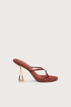 A sandal with thin, smooth leather straps on a cushioned base and a metallic heel that plays with negative space.- Smooth leather straps- Shiny, metal heel- Rubber sole- Cushioned base Metallic Heels, Cult Gaia, Ladies Shoes, Negative Space, Spring Summer Outfits, Cow Leather, Leather Heels, Smooth Leather, Kid Shoes