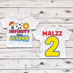 two matching shirts with the number two on them, one for each child to wear