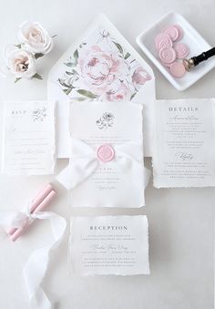 the wedding stationery is laid out and ready to be used