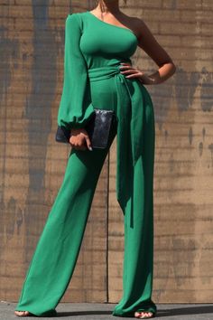 One Shoulder Jumpsuit - Dark Green This jumpsuit is a statement in itself! Perfect for date night or brunch with the ladies! This green jumpsuit comes in a wide pant leg featuring a long sleeve one shoulder, adjustable tie belt, and side zipper. Pair this with a stylish heel and handbag for a complete look. One Shoulde Belted Jumpsuit For Date Night, Solid Belted Jumpsuit For Date Night, Belted Jumpsuit Or Romper For Date Night, Belted Jumpsuits And Rompers For Date Night, Chic Green Jumpsuits And Rompers For Night Out, Chic Green Evening Jumpsuits And Rompers, Chic Green Long Sleeve Jumpsuits And Rompers, Spring Party Jumpsuits With Tie Waist, One-shoulder Jumpsuits And Rompers For Spring Date Night