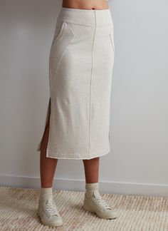 Paired with the Kenny Pullover, this ultra-cool sweatshirt skirt makes for a leveled up sweat set that will take you from lounging to brunch and beyond. How it fits: Easy slim fit. Fits close to body at waist ﻿How to style: ﻿Pairs with sneak for a casual lookMaterial: Cotton, PolyesterContent: 60% Cotton, 40% Polyester Stretch: LightLength: Regular Fit: Relaxed FitFeel: SoftTexture: MediumLined: Unlined Color: Grey Casual Fall Loungewear Skirt, Fitted Cotton Skirt For Loungewear, Relaxed Fit Cotton Skirt For Loungewear, Relaxed Cotton Skirt For Loungewear, Casual Cotton Skirt For Loungewear, Cotton Stretch Skirt For Loungewear, Casual Pencil Skirt For Loungewear, Sweat Set, Gray Skirt