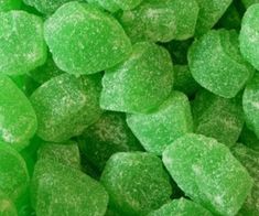 green gummy bears sitting on top of each other