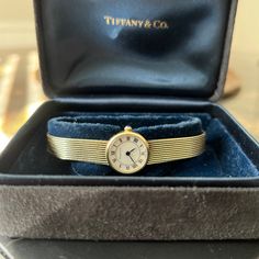 14k Gold Tiffany & Co Ladies 18mm Quartz Watch. This Watch Is Crafted Of 14 Karat Yellow Gold And Features A White Dial, Roman Numeral Hour Markers, Mineral Glass Crystal, And A Quartz Movement. Stamped '14k, 585, Swiss Made Comes With Two Boxes As Shown Recently Serviced And Cleaned At Reiner's Fine Jewelry In Houston. Has A New Battery. Gold Tiffany, Roman Numeral, Tiffany And Co, White Dial, Glass Crystal, Roman Numerals, Swiss Made, Tiffany & Co., Vintage Watches