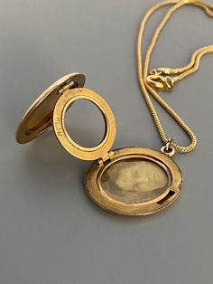 "Weight: 11.9g Dimensions: 1\" round, 18\" chain Hallmarks: Makers mark L & M Although these lockets were patented in the year 1902, this particular locket states on its backside that it is from the 'class of '12' dating it to a decade later. This is a very unique locket in that it has 3 windows and folds like an accordion. All bezels are present and the two clear windows inside the front and back covers are still present. The locket measures 1\" round and comes on an 18\" GF chain. Very lig Victorian Round Locket Necklace Stamped 14k, Antique Medallion Locket Necklace Stamped 14k, Victorian Style Medallion Coin Pendant Jewelry, Victorian Jewelry With Coin Pendant, Classic 14k Stamped Medallion Locket Necklace, Victorian Yellow Gold Medallion Locket Necklace, Victorian Yellow Gold Locket Necklace, Antique Yellow Gold Locket Necklace, Victorian Style Yellow Gold Locket Necklace