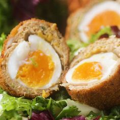 an egg in bread with lettuce and carrots on the side is shown