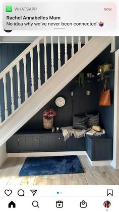 the stairs in this house have been painted dark blue and are decorated with white balconies