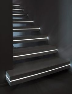 a set of stairs lit up with white lights